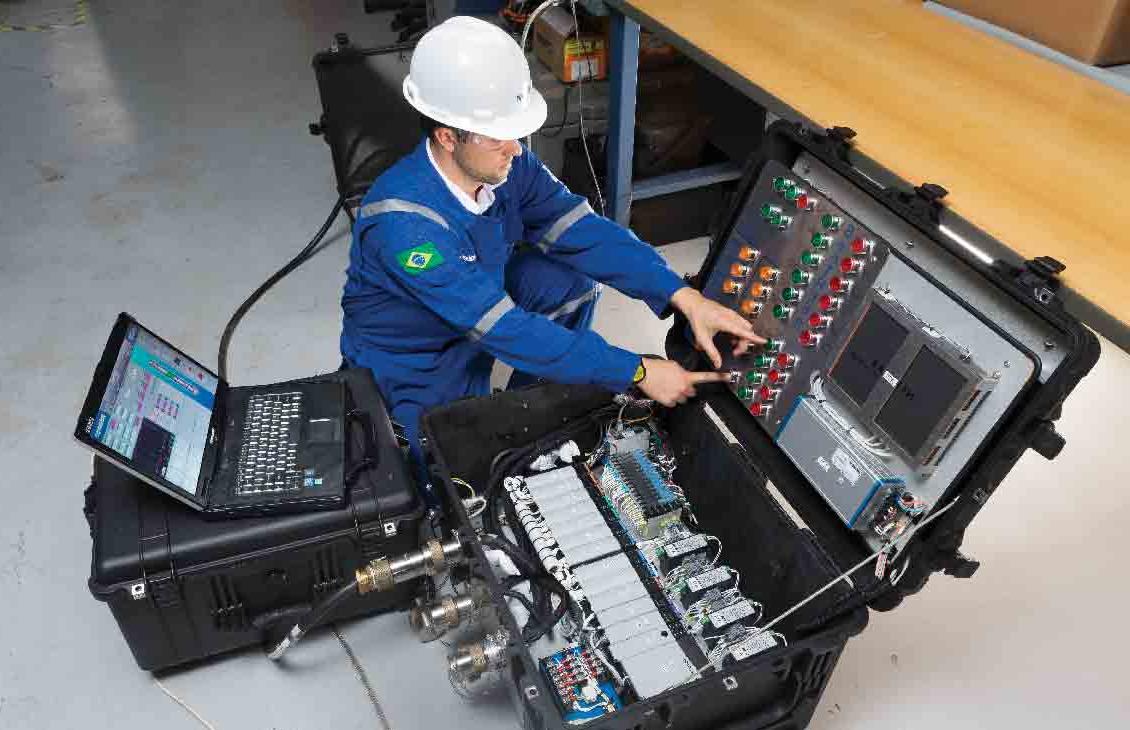 Man pushing a button on the SenTREE 3 console.